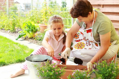 Gardener tending to plants in a Ringwood backyard